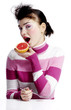 Woman eating blood orange.