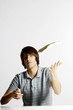 Man tossing a dough.