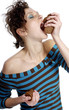 Greedy woman eating biscuits.
