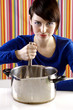 Photo: Woman whipping eggs with a whisk. Woman whipping eggs with a whisk.