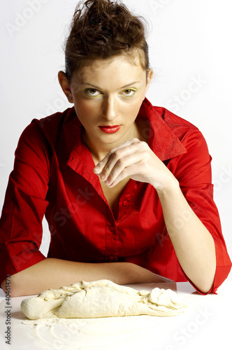 Photo: Woman making dough. Woman making dough.