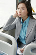 Businesswoman writing organizer in the train.
