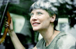 Woman enjoying the view from inside the taxi.