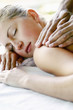 Woman enjoying a body massage.