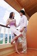 Couple talking on the balcony.