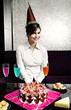 Foto: Woman celebrating her birthday. Woman celebrating her birthday.