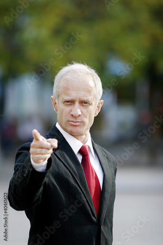 Photo: Businessman pointing his finger. Businessman pointing his finger.