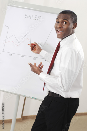 Photo: Businessman looking at the sales chart. Businessman looking at the sales chart.