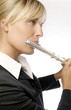 Woman playing flute.
