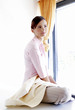 Woman sitting by the window.