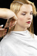 Woman having a haircut.