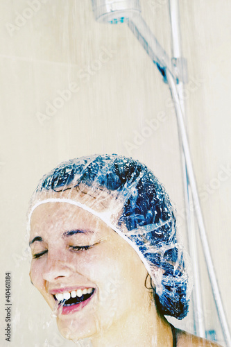 Photo: Woman taking shower. Woman taking shower.