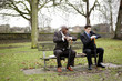 Businessmen in shock after looking at their watches.