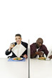 Businessmen enjoying their meal.