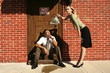 Photo: Businesswoman pouring water at businessman's cigarette. Businesswoman pouring water at businessman's cigarette.