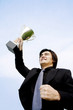 Businessman showing off his trophy.