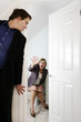 Photo: Businessman peeping his female colleague in the toilet. Businessman peeping his female colleague in the toilet.