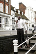 Businessman pulling his stubborn dog.