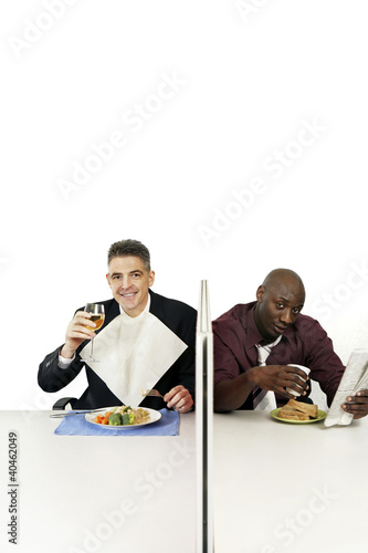 Photo: Businessmen enjoying their meal. Businessmen enjoying their meal.