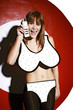 Foto: Woman in bikini holding a handphone. Woman in bikini holding a handphone.