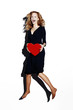 Businesswoman holding a red heart.