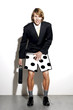 Businessman feeling ashamed for wearing boxer shorts to work.