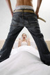 Man taking off his pants shocking his wife.