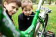 Boy on a bicycle in the green park