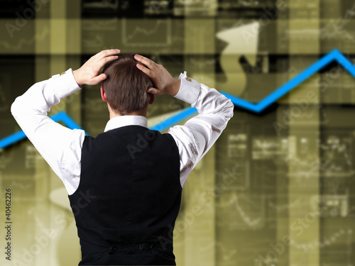 Illustration: Young businessman against financial graphs Young businessman against financial graphs