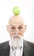 Photo: Old professor with a green apple on top of his head. Old professor with a green apple on top of his head.