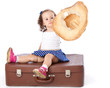 A girl is sitting on a suitcase. A girl is sitting on a suitcase.