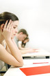 Photo: Woman not paying attention in class. Woman not paying attention in class.