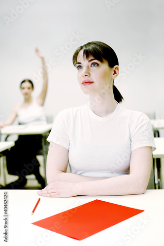 Photo: Woman paying attention in class. Woman paying attention in class.