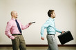 Businessman controlling his colleague with a remote control.