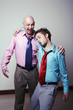 Businessman helping his drunk friend.