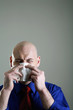 Businessman blowing his nose.