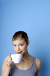Woman drinking coffee.