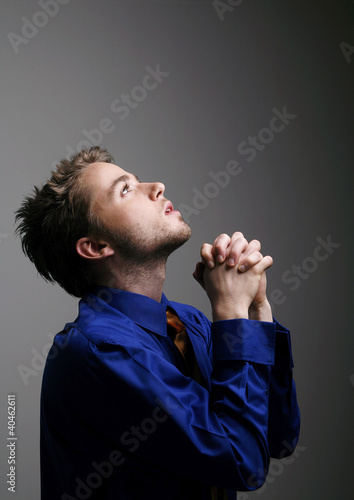 Photo: Businessman praying. Businessman praying.