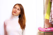 Young woman inside a store buying clothes