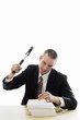 Businessman hammering a nail into a stack of papers.