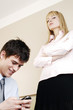 Businessman text messaging during office hour.