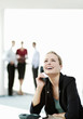 Businesswoman laughing while talking on the phone.