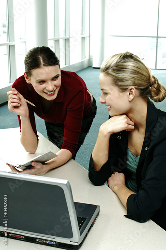 Photo: Businesswomen having discussion. Businesswomen having discussion.