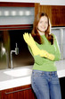 Photo: Woman wearing rubber gloves. Woman wearing rubber gloves.