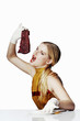 Woman about to bite on a meat.