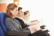 Students paying attention in lecture hall.