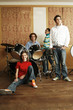 Foto: Teenagers in a musical band. Teenagers in a musical band.