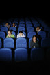 Teenagers watching movie in cinema.