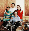Foto: Teenagers in a musical band. Teenagers in a musical band.