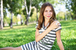 Photo: Young woman in summer park Young woman in summer park